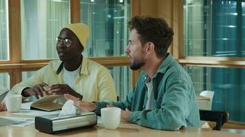 Multiethnic business team of coworkers discussing a project while sitting at the bar during lunch.Different Races,Diverse People,Creative Team,Business Partners video