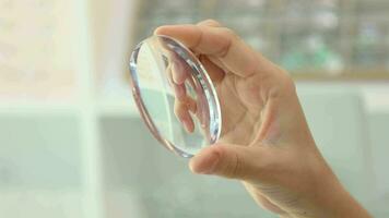 Hand holding lens eyeglasses, lenses glasses video