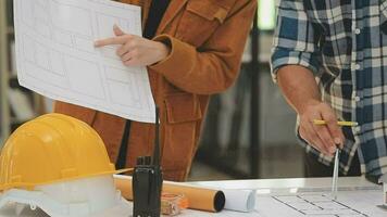 Two businessmen and energy engineers partners discussing new project about energy solar panel. video