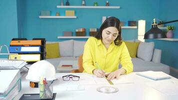 Architect young woman drawing a project. video