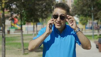 The man is very happy when he receives the good news on the phone. video