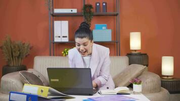 Home office worker woman reading good news and feeling happy. video