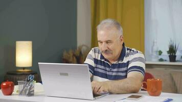 Home office worker man getting good news on the phone. video