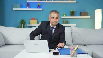 Home office worker man making negative gesture at camera. video