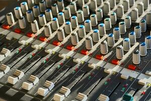 Mixing console for controlling the volume, frequencies of musical instruments photo