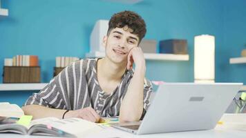 Smiling student looking at camera blows a kiss. video