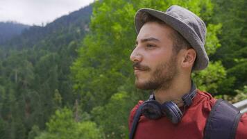 Free young man walking in the forest. video