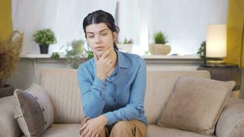 Woman looking thoughtfully at camera. video