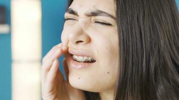 Close-up of young woman suffering from toothache. video