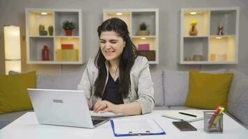 Home office worker woman reading good news and feeling happy. video