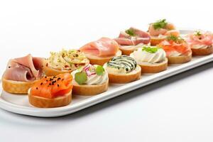 Assorted canapes brightly illuminated under kitchen lights isolated on a white background photo