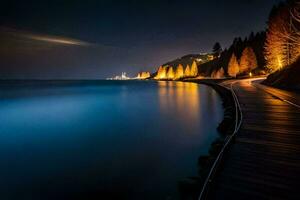 un largo exposición foto de un paseo marítimo a lo largo el agua a noche. generado por ai