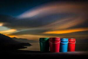 four colorful buckets sit on a rock in front of the ocean. AI-Generated photo