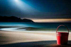 a red bucket sits on the beach at night. AI-Generated photo