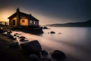 a small house sits on the shore of a lake at sunset. AI-Generated photo