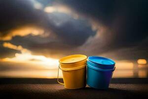 two buckets sit on the ground in front of a sunset. AI-Generated photo