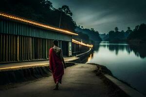 un monje camina a lo largo el río a noche. generado por ai foto