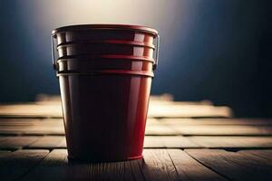 a red bucket sitting on a wooden table. AI-Generated photo