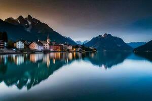 un lago y montañas a oscuridad. generado por ai foto