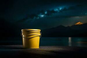 a yellow bucket sitting on the ground at night. AI-Generated photo