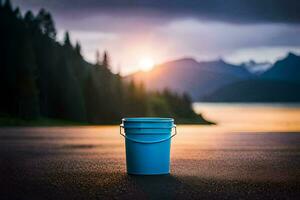 a blue bucket sits on the road in front of a lake. AI-Generated photo