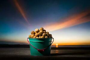 a bucket of nuts on the beach at sunset. AI-Generated photo