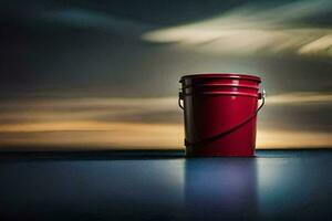 un rojo Cubeta sentado en un mesa en frente de un nublado cielo. generado por ai foto