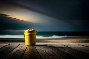 un amarillo Cubeta en un de madera cubierta con vista a el océano. generado por ai foto