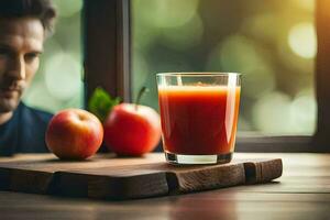 a man sitting in front of a glass of juice with apples. AI-Generated photo