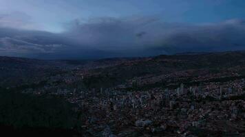 Sparkling La Paz Skyline at Evening Twilight. Aerial View. Zona Sur District. Bolivia. Blue Hour. Drone Flies Sideways. Wide Shot video