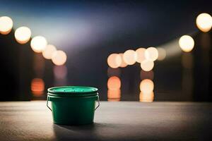 a green bucket sitting on a table in front of a blurry background. AI-Generated photo