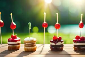 four cupcakes with toothpicks on a table. AI-Generated photo