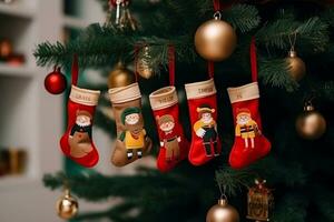 hanging red Christmas stockings filled with gifts, copy space, green background. AI generative photo