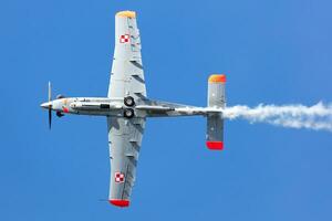 Polish Air Force PZL-130 Orlik trainer plane flying. Orlik aerobatic team. Aviation and military aircraft. photo