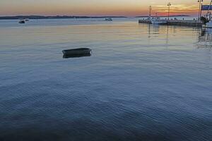 Sunset over the harbor of the Croatian port town of Fazana with a view of the Brijuni Islands photo