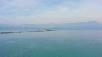 Lake Garda and Sirmione Peninsula. Italy. Aerial View. Drone Flies Sideways video