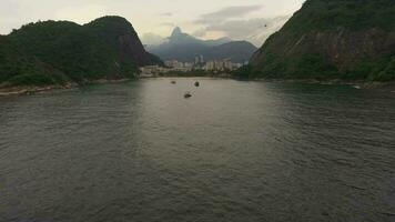 Urca Neighborhood in Rio de Janeiro and Atlantic Ocean. Aerial View. Brazil. Drone Flies Forward, Tilt Up video