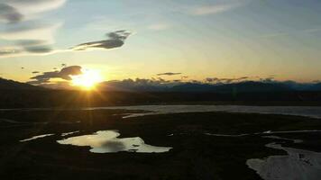 El Calafate City in Patagonia, Argentina at Sunset in Summer. Mountains and Lake. Aerial View. Drone Flies Sideways video