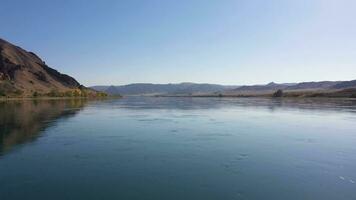 Ili River and Kazakh Steppe on Sunny Day. Aerial View. Drone Flies Forward at Low Level video