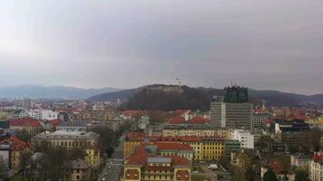 Ljubljana City Center on Cloudy Day. Slovenia, Europe. Aerial View. Drone Flies Upwards, Tilt Down. Crane Shot video