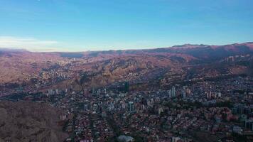 La Paz Skyline at Sunrise. Aerial View. Zona Sur District. Bolivia. Golden Hour. Drone Flies Sideways. Wide Shot video