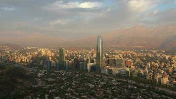 Santiago City at Sunset and Andes Mountains. Aerial View. Chile. Orbiting video