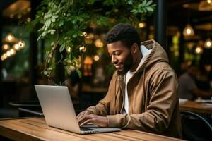 Side view African American people wear hood use laptop on table in coffee cafe. Generative AI photo