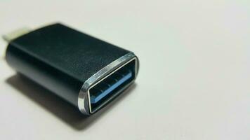 Close up view of 8 pin to micro USB 3.0 adapter on white background to transfer data on the smartphone photo