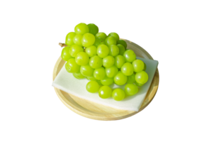 Bunches Shine Muscat grapes placed on foam on wooden plate on transparent background png