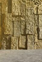 pattern yellow color of ancient style design decorative uneven cracked real stone wall surface with cement. Old sacred tomb facade with sunlight photo