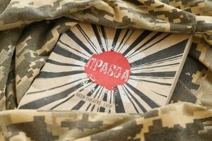 KYIV, UKRAINE - MAY 4, 2022 Logo of Pravda patriotic Ukrainian beverage company on cardboard pack photo