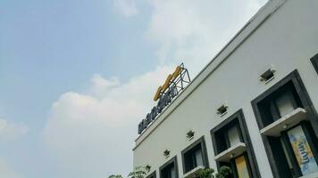 Bank Mandiri logo on top of the building at Kota Tua Jakarta photo