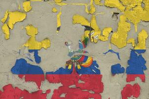 Ecuador flag depicted in paint colors on old obsolete messy concrete wall closeup. Textured banner on rough background photo