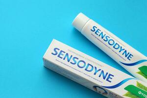 KYIV, UKRAINE - MAY 4, 2022 Sensodyne fluorine or fluor is a daily fluoride toothpaste photo